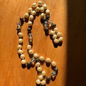 Long costume pearl, rainbow crystal, and brass necklace